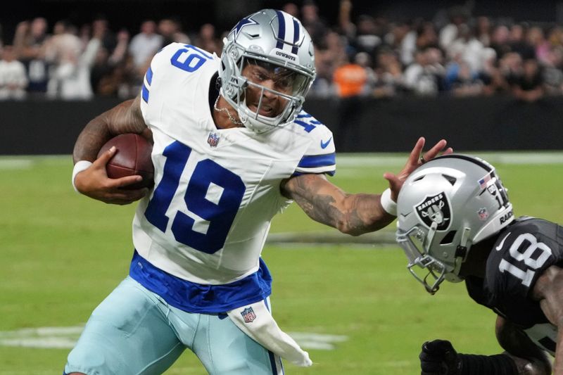 Dallas Cowboys quarterback Trey Lance runs against Las Vegas Raiders cornerback Jack Jones (18) during the first half of an NFL preseason football game, Saturday, Aug. 17, 2024, in Las Vegas. (AP Photo/Rick Scuteri)