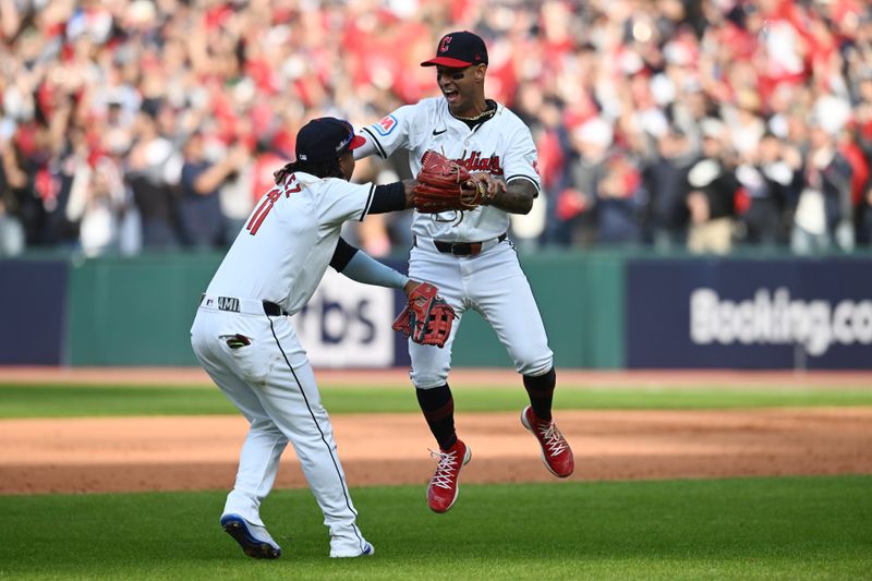 Oct 12, 2024; Cleveland, Ohio, USA; Cleveland Guardians third base José Ramírez (11) celebrates with shortstop Brayan Rocchio (4) after defeating the Detroit Tigers during game five of the ALDS for the 2024 MLB Playoffs at Progressive Field. Mandatory Credit: Ken Blaze-Imagn Images