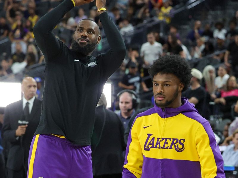 LAS VEGAS, NEVADA - OCTOBER 15: LeBron James (L) #23 and Bronny James #9 of the Los Angeles Lakers warm up before a preseason game against the Golden State Warriors at T-Mobile Arena at T-Mobile Arena on October 15, 2024 in Las Vegas, Nevada. NOTE TO USER: User expressly acknowledges and agrees that, by downloading and or using this photograph, User is consenting to the terms and conditions of the Getty Images License Agreement. (Photo by Ethan Miller/Getty Images)