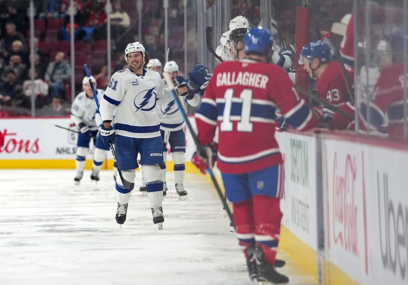 Dec 9, 2025; Montreal, Quebec, CAN; Tampa Bay Lightning defenseman Charles-Edouard D'Astous (51) celebrates with teammates after scoring a goal against the Montreal Canadiens during the second period at the Bell Centre. Mandatory Credit: Eric Bolte-Imagn Images