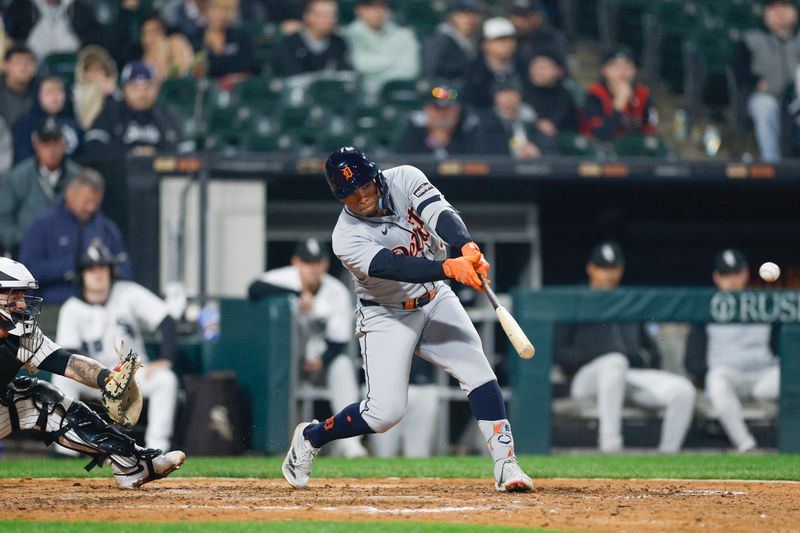 Jun 4, 2025; Chicago, Illinois, USA; Detroit Tigers right fielder Wenceel Pérez (46) doubles against the Chicago White Sox during the eight inning at Rate Field. Mandatory Credit: Kamil Krzaczynski-Imagn Images