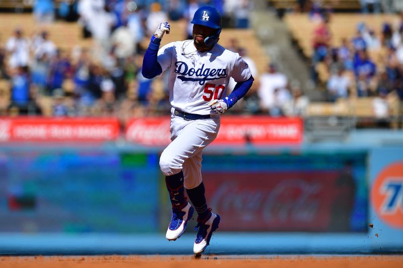 Jun 25, 2023; Los Angeles, California, USA; Los Angeles Dodgers second baseman Mookie Betts (50) rounds the bases after hitting a solo home run against the Houston Astros during the first inning at Dodger Stadium. Mandatory Credit: Gary A. Vasquez-USA TODAY Sports