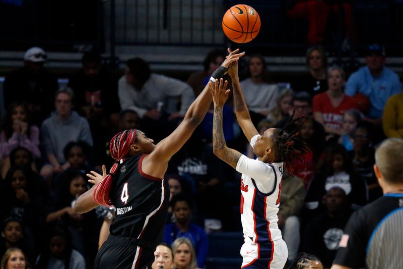 Feb 19, 2023; Oxford, Mississippi, USA; South Carolina Gamecocks forward Aliyah Boston (4) blocks a shot by Mississippi Rebels guard Destiny Salary (10) during the second half at The Sandy and John Black Pavilion at Ole Miss. Mandatory Credit: Petre Thomas-USA TODAY Sports