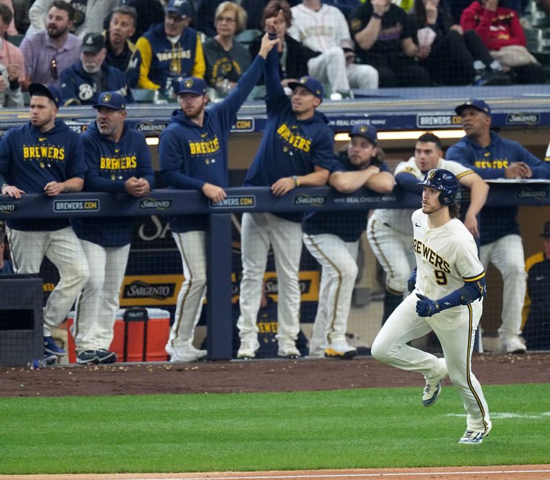 May 24, 2023; Milwaukee, Wisconsin, USA; Milwaukee Brewers third baseman Brian Anderson (9) watches his solo home run during the seventh inning of their game against the Houston Astros at American Family Field. Mandatory Credit: Mark Hoffman-USA TODAY Sports