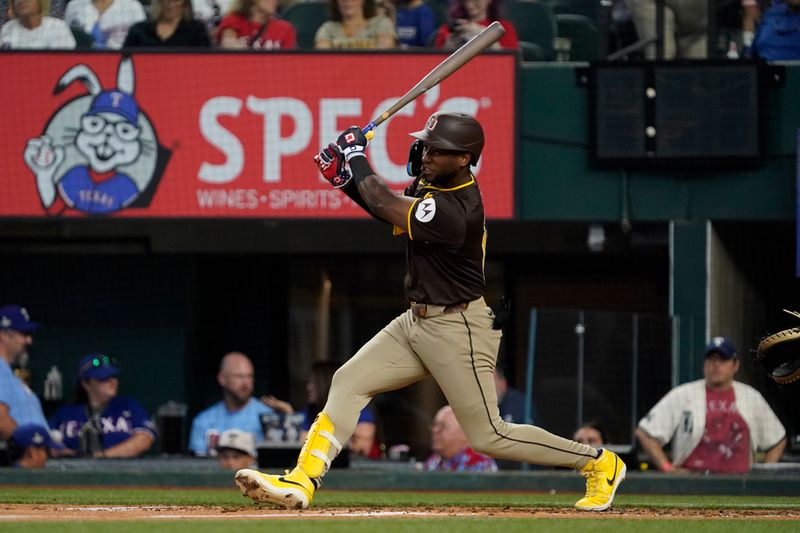 Jul 4, 2024; Arlington, Texas, USA; San Diego Padres outfielder Jurickson Profar (10) hits a single during the fourth inning against the Texas Rangers at Globe Life Field. Mandatory Credit: Raymond Carlin III-USA TODAY Sports