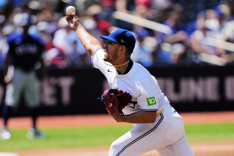 Jul 28, 2024; Toronto, Ontario, CAN; Toronto Blue Jays starting pitcher José Berríos (17) pitches to the Texas Rangers during the third inning at Rogers Centre. Mandatory Credit: John E. Sokolowski-USA TODAY Sports