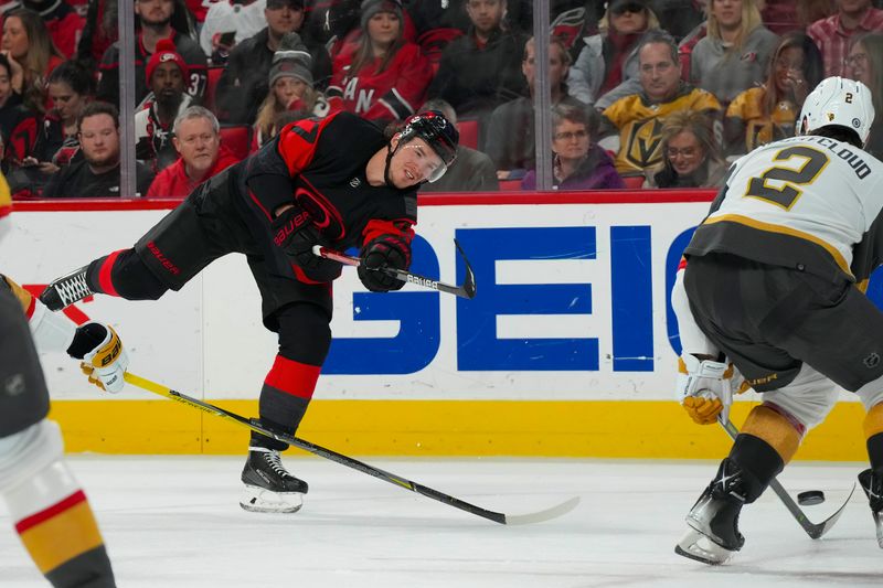 Mar 11, 2023; Raleigh, North Carolina, USA; Carolina Hurricanes right wing Andrei Svechnikov (37) takes a shot against the Vegas Golden Knights during the third period at PNC Arena. Mandatory Credit: James Guillory-USA TODAY Sports