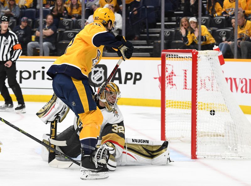 Apr 4, 2023; Nashville, Tennessee, USA; Nashville Predators center Tommy Novak (82). scores against Vegas Golden Knights goaltender Jonathan Quick (32) during the first period at Bridgestone Arena. Mandatory Credit: Christopher Hanewinckel-USA TODAY Sports