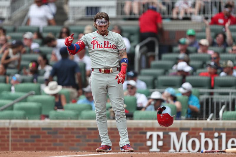 Jun 29, 2025; Cumberland, Georgia, Philadelphia Phillies second baseman Bryson Stott (5) reacts to striking out during a game against the Atlanta Braves the sixth inning at Truist Park. Mandatory Credit: Mady Mertens-Imagn Images