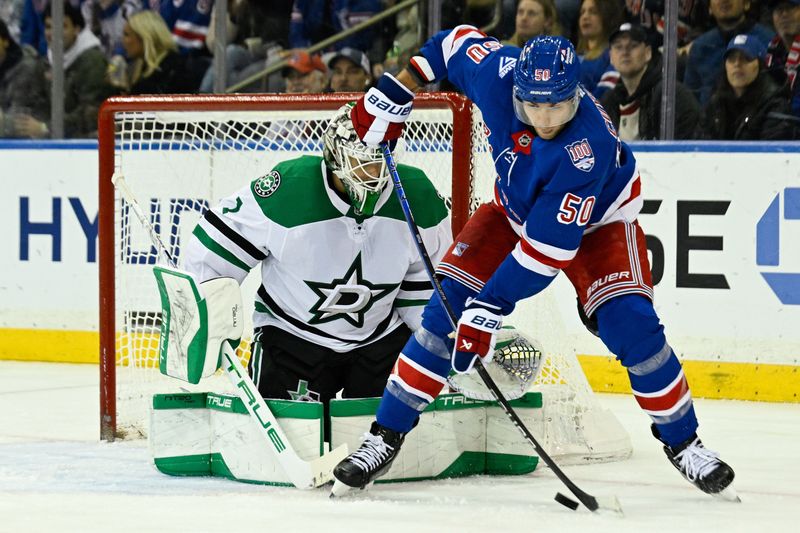 Dec 2, 2025; New York, New York, USA;  New York Rangers left wing Will Cuylle (50) plays the puck in front Dallas Stars goaltender Casey Desmith (1) during the third period at Madison Square Garden. Mandatory Credit: Dennis Schneidler-Imagn Images