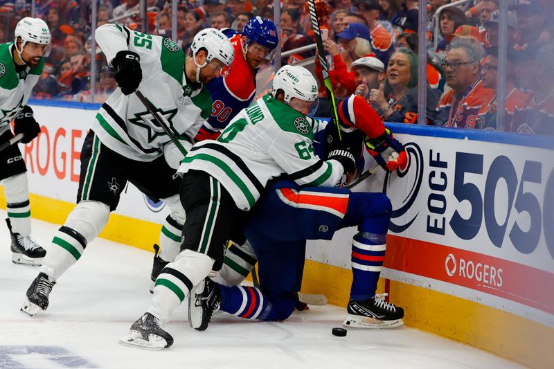 May 25, 2025; Edmonton, Alberta, CAN; The Dallas Stars and Edmonton Oilers battle for the puck during the third period in game three of the Western Conference Final of the 2025 Stanley Cup Playoffs at Rogers Place. Mandatory Credit: Perry Nelson-Imagn Images