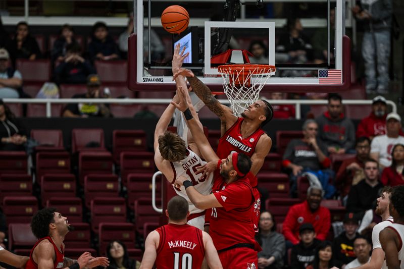 Jan 2, 2025; Stanford, California, USA; Stanford Cardinal forward Oskar Giltay (15) is fouled by Louisville Cardinals forward Khani Rooths (9) during the first half at Maples Pavilion. Mandatory Credit: Justine Willard-Imagn Images