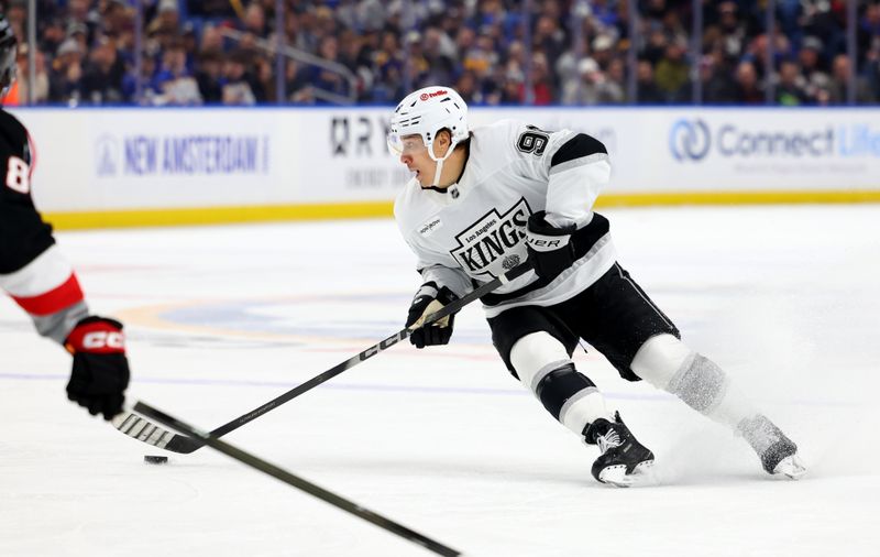 Jan 29, 2026; Buffalo, New York, USA;  Los Angeles Kings left wing Andrei Kuzmenko (96) controls the puck during the first period against the Buffalo Sabres at KeyBank Center. Mandatory Credit: Timothy T. Ludwig-Imagn Images