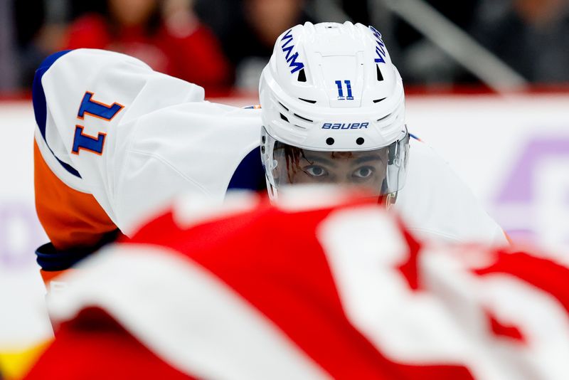Nov 20, 2025; Detroit, Michigan, USA;  New York Islanders left wing Anthony Duclair (11) gets set during a face off in the first period against the Detroit Red Wings at Little Caesars Arena. Mandatory Credit: Rick Osentoski-Imagn Images