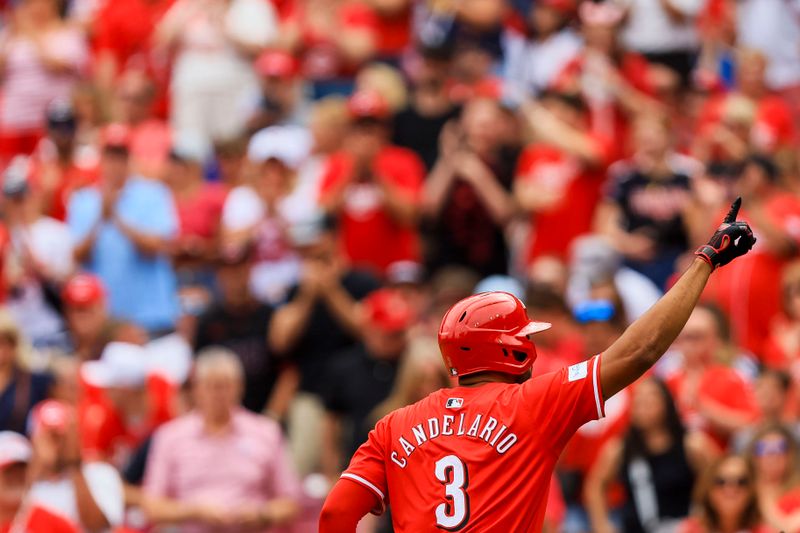 Jun 8, 2024; Cincinnati, Ohio, USA; Cincinnati Reds third baseman Jeimer Candelario (3) reacts after hitting a solo home run in the first inning against the Chicago Cubs at Great American Ball Park. Mandatory Credit: Katie Stratman-USA TODAY Sports