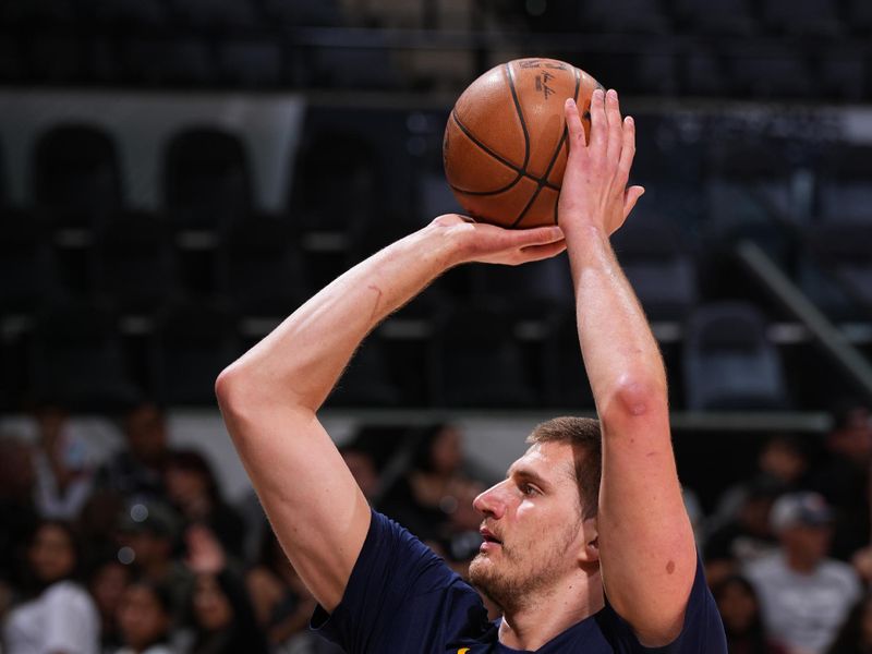 SAN ANTONIO, TX - APRIL 12: Nikola Jokic #15 of the Denver Nuggets warms up before the game against the San Antonio Spurs on April 12, 2024 at the Frost Bank Center in San Antonio, Texas. NOTE TO USER: User expressly acknowledges and agrees that, by downloading and or using this photograph, user is consenting to the terms and conditions of the Getty Images License Agreement. Mandatory Copyright Notice: Copyright 2024 NBAE (Photos by Garrett Ellwood/NBAE via Getty Images)