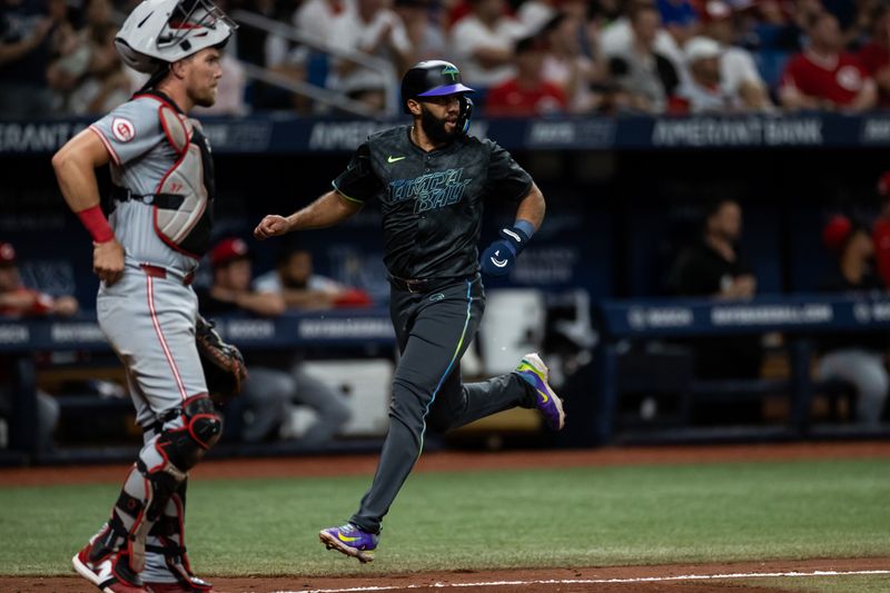 Jul 27, 2024; St. Petersburg, Florida, USA; Tampa Bay Rays outfielder Amed Rosario (10) scores a run against the Cincinnati Reds during the fifth inning at Tropicana Field. Mandatory Credit: Matt Pendleton-USA TODAY Sports