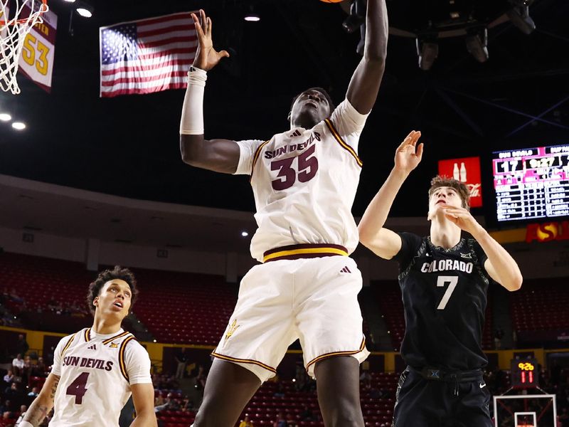 Jan 3, 2026; Tempe, Arizona, USA; Arizona State Sun Devils center Massamba Diop (35) grabs a rebound against the Colorado Buffaloes in the first half at Desert Financial Arena. Mandatory Credit: Mark J. Rebilas-Imagn Images