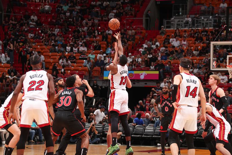 MIAMI, FL - APRIL 14:  Open tip-off between Bam Adebayo #13 of the Miami Heat & Kelly Olynyk #41 of the Toronto Raptors on April 14, 2024 at Kaseya Center in Miami, Florida. NOTE TO USER: User expressly acknowledges and agrees that, by downloading and or using this Photograph, user is consenting to the terms and conditions of the Getty Images License Agreement. Mandatory Copyright Notice: Copyright 2024 NBAE (Photo by Issac Baldizon/NBAE via Getty Images)