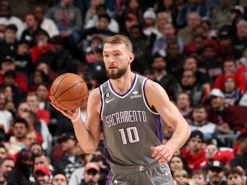 CHICAGO, IL - MARCH 15: Domantas Sabonis #10 of the Sacramento Kings dribbles the ball during the game against the Chicago Bulls on March 15, 2023 at United Center in Chicago, Illinois. NOTE TO USER: User expressly acknowledges and agrees that, by downloading and or using this photograph, User is consenting to the terms and conditions of the Getty Images License Agreement. Mandatory Copyright Notice: Copyright 2023 NBAE (Photo by Gary Dineen/NBAE via Getty Images)