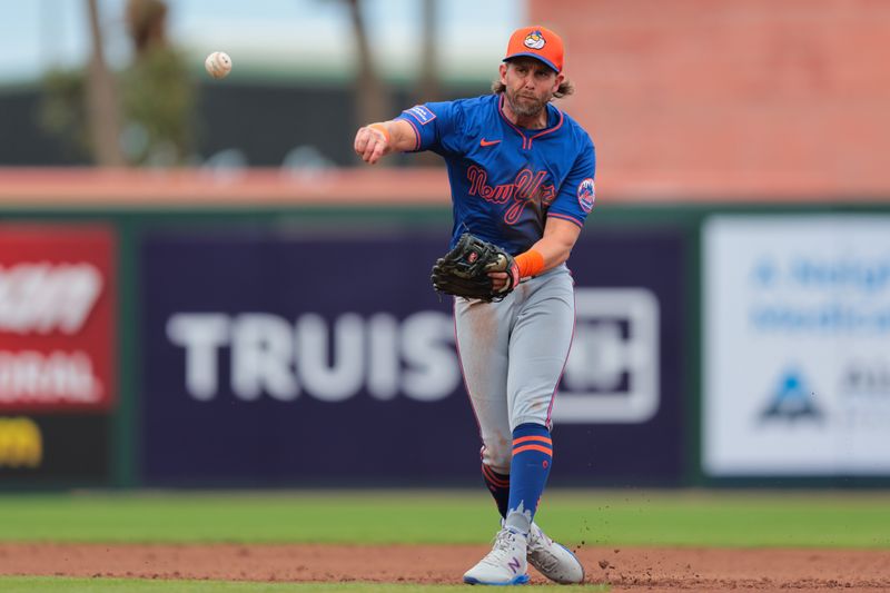 Feb 24, 2025; Jupiter, Florida, USA; New York Mets second baseman Jeff McNeil (1) turns a double play against the St. Louis Cardinals during the second inning at Roger Dean Chevrolet Stadium. Mandatory Credit: Sam Navarro-Imagn Images