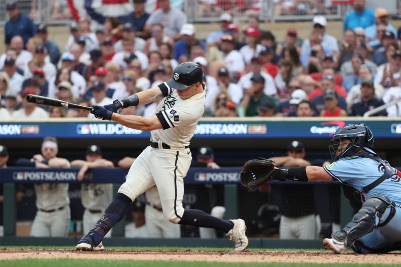 Oct 3, 2023; Minneapolis, Minnesota, USA; Minnesota Twins right fielder Max Kepler (26) hits a single in the sixth inning against the Toronto Blue Jays during game one of the Wildcard series for the 2023 MLB playoffs at Target Field. Mandatory Credit: Jesse Johnson-USA TODAY Sports