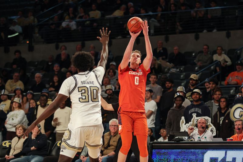 Jan 14, 2025; Atlanta, Georgia, USA; Clemson Tigers center Viktor Lakhin (0) shoots the ball over Georgia Tech Yellow Jackets forward Ibrahim Souare (30) during the second half at McCamish Pavilion. Mandatory Credit: Jordan Godfree-Imagn Images