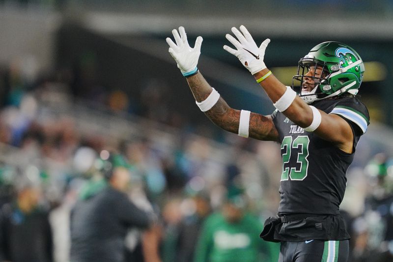 Nov 17, 2022; New Orleans, Louisiana, USA; Tulane Green Wave safety Lummie Young IV (23) celebrates an interception against the Southern Methodist Mustangs during the second half at Yulman Stadium. Mandatory Credit: Andrew Wevers-USA TODAY Sports