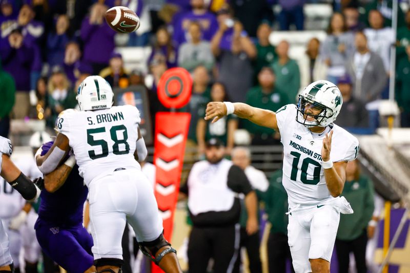 Sep 17, 2022; Seattle, Washington, USA; Michigan State Spartans quarterback Payton Thorne (10) passes against the Washington Huskies during the fourth quarter at Alaska Airlines Field at Husky Stadium. Mandatory Credit: Joe Nicholson-USA TODAY Sports