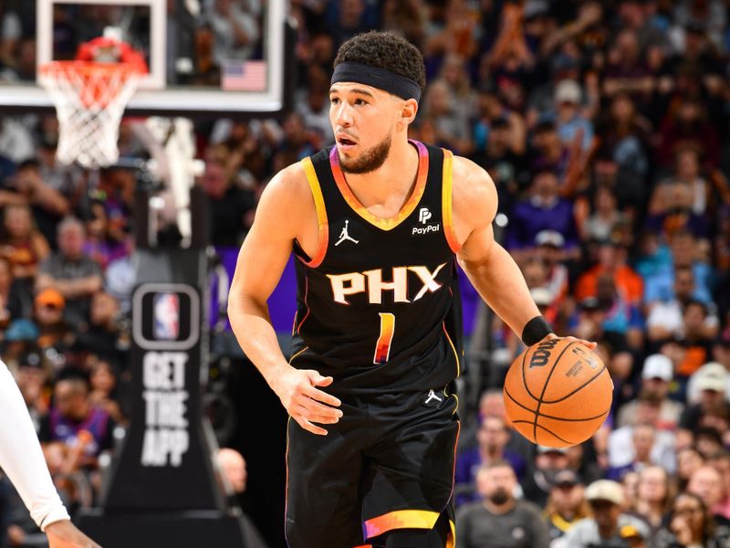 PHOENIX, AZ - APRIL 3: Devin Booker #1 of the Phoenix Suns handles the ball during the game on April 3, 2024 at Footprint Center in Phoenix, Arizona. NOTE TO USER: User expressly acknowledges and agrees that, by downloading and or using this photograph, user is consenting to the terms and conditions of the Getty Images License Agreement. Mandatory Copyright Notice: Copyright 2024 NBAE (Photo by Barry Gossage/NBAE via Getty Images)