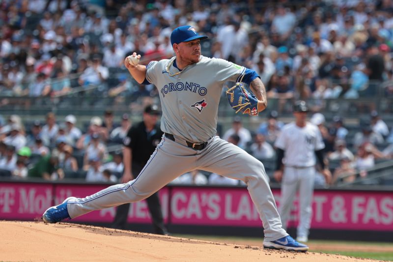 Aug 4, 2024; Bronx, New York, USA; Toronto Blue Jays starting pitcher Yariel Rodriguez (29) delivers a pitch during the first inning against the New York Yankees at Yankee Stadium. Mandatory Credit: Vincent Carchietta-USA TODAY Sports