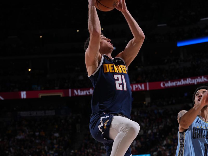 DENVER, CO - MARCH 25: Collin Gillespie #21 of the Denver Nuggets drives to the basket during the game against the Memphis Grizzlies on March 25, 2024 at the Ball Arena in Denver, Colorado. NOTE TO USER: User expressly acknowledges and agrees that, by downloading and/or using this Photograph, user is consenting to the terms and conditions of the Getty Images License Agreement. Mandatory Copyright Notice: Copyright 2024 NBAE (Photo by Bart Young/NBAE via Getty Images)