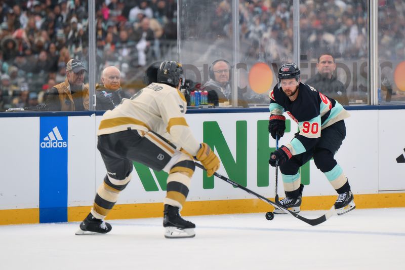 Jan 1, 2024; Seattle, Washington, USA; Seattle Kraken left wing Tomas Tatar (90) advances the puck while defended by Vegas Golden Knights defenseman Zach Whitecloud (2) during the second period in the 2024 Winter Classic ice hockey game at T-Mobile Park. Mandatory Credit: Steven Bisig-USA TODAY Sports