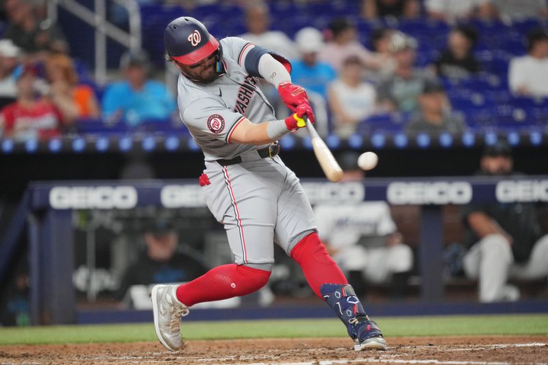 Sep 3, 2024; Miami, Florida, USA;  Washington Nationals designated hitter Andrés Chaparro (19) hits a double in the fourth inning against the Miami Marlins at loanDepot Park. Mandatory Credit: Jim Rassol-Imagn Images.