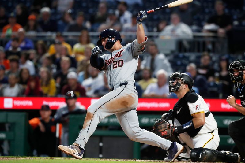 Apr 8, 2024; Pittsburgh, Pennsylvania, USA;  Detroit Tigers first baseman Spencer Torkelson (20) hits a double against the Pittsburgh Pirates during the fifth inning at PNC Park. Mandatory Credit: Charles LeClaire-USA TODAY Sports