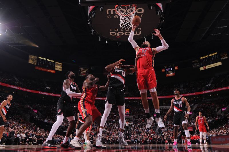 PORTLAND, OR - APRIL 9: Jonas Valanciunas #17 of the New Orleans Pelicans drives to the basket during the game against the Portland Trail Blazers on April 9, 2024 at the Moda Center Arena in Portland, Oregon. NOTE TO USER: User expressly acknowledges and agrees that, by downloading and or using this photograph, user is consenting to the terms and conditions of the Getty Images License Agreement. Mandatory Copyright Notice: Copyright 2024 NBAE (Photo by Cameron Browne/NBAE via Getty Images)