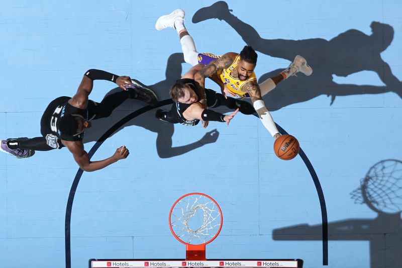 MEMPHIS, TN - APRIL 19: D'Angelo Russell #1 of the Los Angeles Lakers drives to the basket during the game against the Memphis Grizzlies during Round One Game Two of the 2023 NBA Playoffs on April 19, 2023 at FedExForum in Memphis, Tennessee. NOTE TO USER: User expressly acknowledges and agrees that, by downloading and or using this photograph, User is consenting to the terms and conditions of the Getty Images License Agreement. Mandatory Copyright Notice: Copyright 2023 NBAE (Photo by Joe Murphy/NBAE via Getty Images)