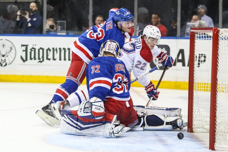 Feb 15, 2024; New York, New York, USA; Montreal Canadiens right wing Cole Caufield (22) pushes the puck past New York Rangers goaltender Jonathan Quick (32) for a goal in the third period at Madison Square Garden. Mandatory Credit: Wendell Cruz-USA TODAY Sports