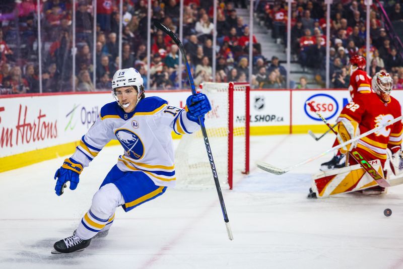 Mar 24, 2024; Calgary, Alberta, CAN; Buffalo Sabres center Peyton Krebs (19) celebrates his goal against Calgary Flames goaltender Dustin Wolf (32) during the first period at Scotiabank Saddledome. Mandatory Credit: Sergei Belski-USA TODAY Sports