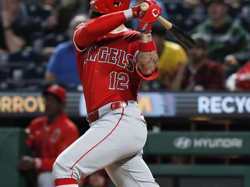 May 7, 2024; Pittsburgh, Pennsylvania, USA; Los Angeles Angels left fielder Kevin Pillar (12) hits a solo home run which was his second home run of the game against the Pittsburgh Pirates during the seventh inning at PNC Park. Mandatory Credit: Charles LeClaire-USA TODAY Sports