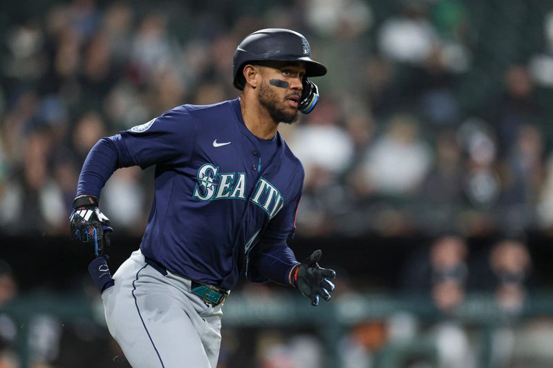 May 19, 2025; Chicago, Illinois, USA; Seattle Mariners center fielder Julio Rodríguez (44) rounds the bases after hitting a grand slam against the Chicago White Sox during the eight inning at Rate Field. Mandatory Credit: Kamil Krzaczynski-Imagn Images