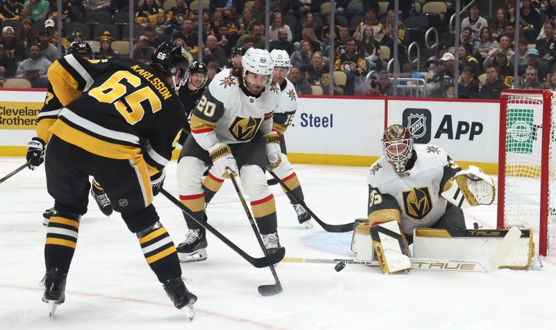 Mar 11, 2025; Pittsburgh, Pennsylvania, USA;  Vegas Golden Knights goaltender Ilya Samsonov (35) makes a save against Pittsburgh Penguins defenseman Erik Karlsson (65) during the third period at PPG Paints Arena. Mandatory Credit: Charles LeClaire-Imagn Images