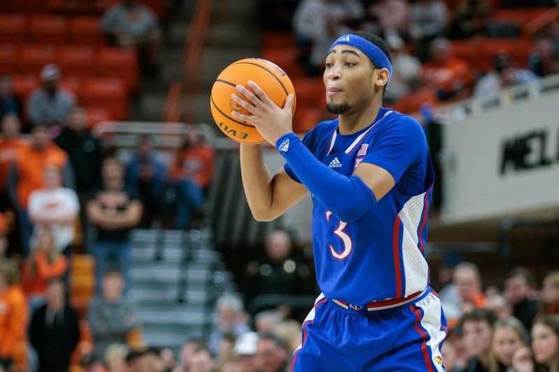 Jan 16, 2024; Stillwater, Oklahoma, USA; Kansas Jayhawks guard Dajuan Harris Jr. (3) looks to pass during the second half against the Oklahoma State Cowboys at Gallagher-Iba Arena. Mandatory Credit: William Purnell-USA TODAY Sports