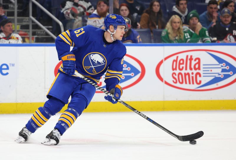 Mar 9, 2023; Buffalo, New York, USA;  Buffalo Sabres defenseman Riley Stillman (61) skates with the puck during the third period against the Dallas Stars at KeyBank Center. Mandatory Credit: Timothy T. Ludwig-USA TODAY Sports