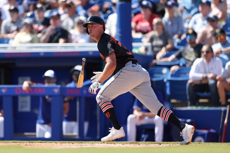 Feb 28, 2025; Dunedin, Florida, USA; Detroit Tigers outfielder Kerry Carpenter (30) hits a base hit against the Toronto Blue Jays in the second inning during spring training at TD Ballpark. Mandatory Credit: Nathan Ray Seebeck-Imagn Images