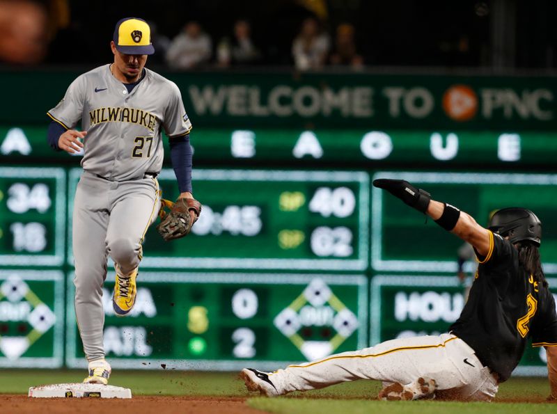 Apr 23, 2024; Pittsburgh, Pennsylvania, USA; Milwaukee Brewers shortstop Willy Adames (27) steps on second base for a force out on Pittsburgh Pirates pinch hitter Connor Joe (2) to end the sixth inning at PNC Park. Mandatory Credit: Charles LeClaire-USA TODAY Sports