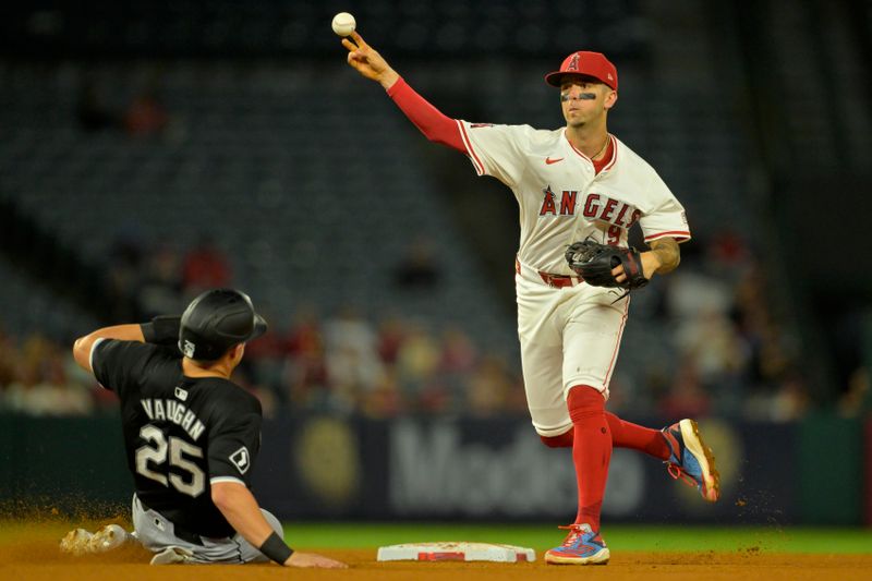 Sep 17, 2024; Anaheim, California, USA;  Chicago White Sox designated hitter Andrew Vaughn (25) is out at second as Los Angeles Angels shortstop Zach Neto (9) completes a double play for the final out of the ninth inning at Angel Stadium. Mandatory Credit: Jayne Kamin-Oncea-Imagn Images