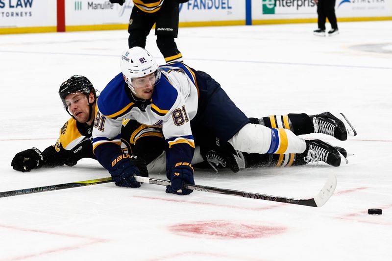 Nov 16, 2024; Boston, Massachusetts, USA; St. Louis Blues center Dylan Holloway (81)and Boston Bruins defenseman Brandon Carlo (25) go down battling for the puck during the second period at TD Garden. Mandatory Credit: Winslow Townson-Imagn Images