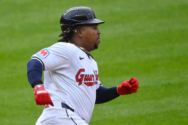 Apr 20, 2024; Cleveland, Ohio, USA; Cleveland Guardians third baseman Jose Ramirez (11) runs out his RBI double in the first inning against the Oakland Athletics at Progressive Field. Mandatory Credit: David Richard-USA TODAY Sports