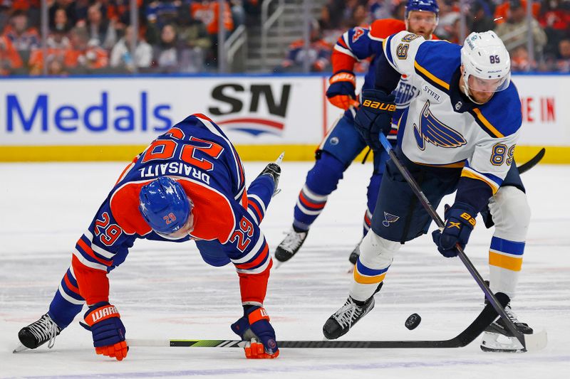 Feb 28, 2024; Edmonton, Alberta, CAN; Edmonton Oilers forward Leon Draisaitl (29) is tripped up while battling for a loose puck with St. Louis Blues forward Pavel Buchnevich (89) during the first period at Rogers Place. Mandatory Credit: Perry Nelson-USA TODAY Sports